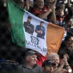Fans of The Shanahans in the stands with an Irish Flag.